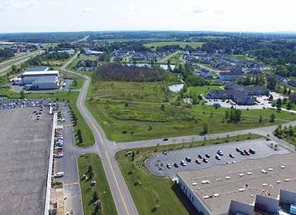 Eastbound Thruway Park Drive, CooperVision (Lots H-J) and Vizix/New Cov Manufacturing (Lot Q).